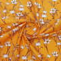 Ткань плательная оранжевая с белыми цветами