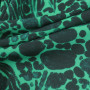 Ткань крепдешин зеленого цветами с пятнистым принтом
