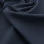 Ткань джинса темного синего цвета 