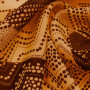 Ткань лен оранжевого цвета с коричневым принтом