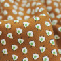 Ткань вискоза твил горчичного цвета с бело-зеленым принтом