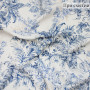 Плательная ткань с молочно-голубым растительным принтом