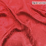 Атласная ткань с фактурным узором карминового цвета