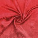 Атласная ткань с фактурным узором карминового цвета