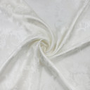 Атласная ткань с фактурным узором молочным узором